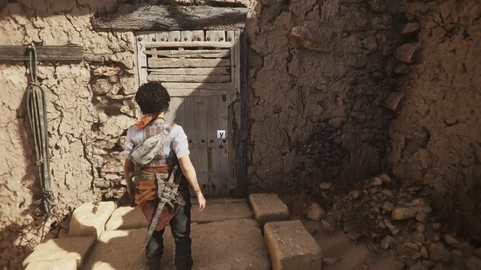 София перед деревянной дверью в каменном проходе — Resonance: A Plague Tale Legacy