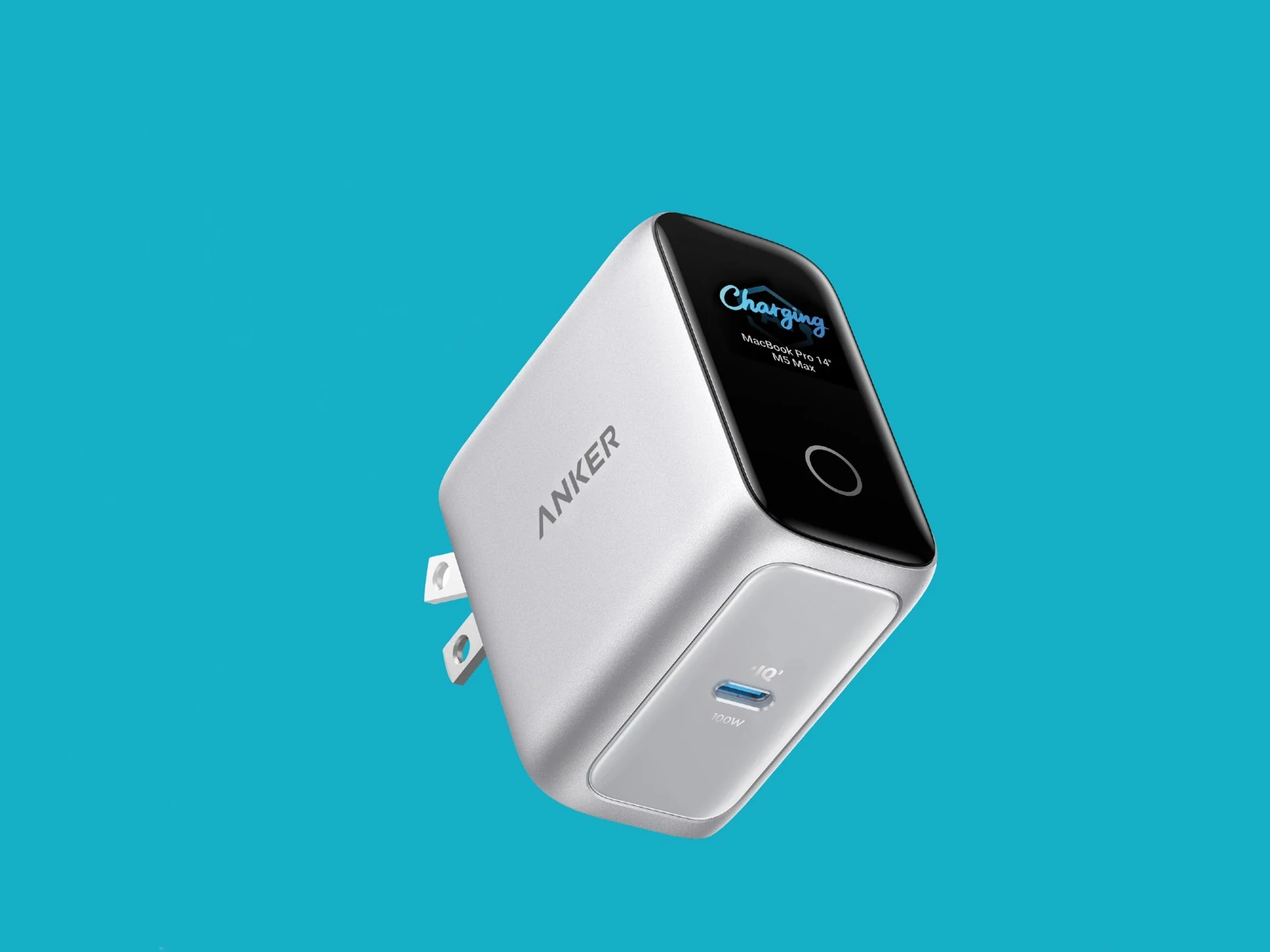 Серебристая зарядка Anker Laptop Charger Pro с дисплеем и одним портом USB-C на голубом фоне