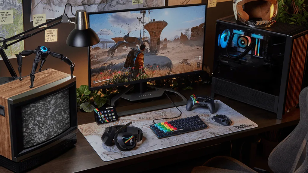 Клавиатура, мышь, гарнитура, геймпад и Stream Deck в оформлении ARC Raiders на игровом столе
